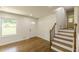 Inviting entryway with wood floors, front door, and staircase to the upper level at 3275 Clifton Church Se Rd, Atlanta, GA 30316