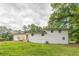A shot of the property's exterior featuring a white brick finish and a deck at 3275 Clifton Church Se Rd, Atlanta, GA 30316