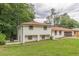 Charming two-story brick home with a well-manicured lawn and an attached two-car garage at 3275 Clifton Church Se Rd, Atlanta, GA 30316