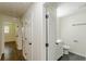 Hallway featuring hardwood floors, neutral walls, and access to bathroom and other rooms at 3275 Clifton Church Se Rd, Atlanta, GA 30316