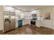 A modern kitchen featuring white cabinets, stainless steel appliances, and wood floors at 3275 Clifton Church Se Rd, Atlanta, GA 30316