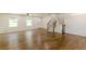 View of the open concept living room showcasing hardwood floors and a staircase at 3275 Clifton Church Se Rd, Atlanta, GA 30316