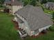 Aerial view of the home highlighting the extensive backyard, patio area, and surrounding neighborhood at 3874 Lost Oak Dr, Buford, GA 30519
