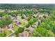 Beautiful aerial shot of a community surrounded by green trees and winding streets offering a sense of peace and privacy at 3874 Lost Oak Dr, Buford, GA 30519
