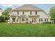 Spacious backyard featuring a well-maintained lawn and a patio area perfect for outdoor entertaining at 3874 Lost Oak Dr, Buford, GA 30519