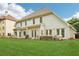 A spacious backyard with a patio, outdoor seating, and a lush green lawn perfect for relaxation and outdoor activities at 3874 Lost Oak Dr, Buford, GA 30519
