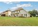 An expansive backyard offers serene outdoor living with a spacious lawn and cozy patio area at 3874 Lost Oak Dr, Buford, GA 30519