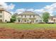 The beautiful backyard with large open space, patio, and furniture for outdoor enjoyment at 3874 Lost Oak Dr, Buford, GA 30519
