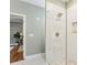 Contemporary bathroom with a glass walk-in shower, white marble floors, and modern fixtures at 3874 Lost Oak Dr, Buford, GA 30519