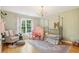 A delightful bedroom with an ornate canopy bed, a chandelier, and decorative angel wings at 3874 Lost Oak Dr, Buford, GA 30519