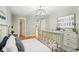 Bedroom boasting hardwood floors, neutral wall paint and decorations, and an overhead light fixture at 3874 Lost Oak Dr, Buford, GA 30519