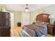 Bedroom with hardwood floors, neutral wall paint, and an overhead light fixture at 3874 Lost Oak Dr, Buford, GA 30519