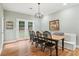Inviting dining room featuring hardwood floors, modern lighting, and french doors to the outdoors at 3874 Lost Oak Dr, Buford, GA 30519