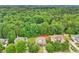 A lush neighborhood with mature trees surrounding beautiful homes with well-maintained yards and landscaping at 3874 Lost Oak Dr, Buford, GA 30519