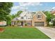 Attractive two-story home with a well-manicured lawn, brick accents, and inviting curb appeal in a desirable neighborhood at 3874 Lost Oak Dr, Buford, GA 30519
