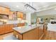 Kitchen with island, granite counters, stainless appliances, open to eat-in kitchen and living room at 3874 Lost Oak Dr, Buford, GA 30519