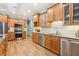 Gourmet kitchen with stainless steel appliances, granite counters, and custom wood cabinetry at 3874 Lost Oak Dr, Buford, GA 30519