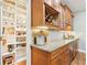 Organized pantry and kitchen with granite countertops and stainless-steel appliances at 3874 Lost Oak Dr, Buford, GA 30519