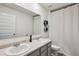 Bathroom with dual sink vanity, modern fixtures, and a shower-tub combo at 5320 Flat Rock Pt, Lithonia, GA 30038