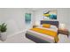 Bright bedroom with a comfortable bed, stylish decor, and an abundance of natural light from the window at 5320 Flat Rock Pt, Lithonia, GA 30038