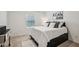 Cozy bedroom features a plush bed, stylish decor, and ample natural light from the window at 5320 Flat Rock Pt, Lithonia, GA 30038