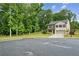 Charming two-story home is situated on a corner lot with mature trees at 5320 Flat Rock Pt, Lithonia, GA 30038
