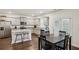 Modern kitchen featuring granite countertops, stainless steel appliances, and a breakfast table at 5320 Flat Rock Pt, Lithonia, GA 30038