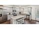 Modern kitchen featuring granite countertops, stainless steel appliances, and a center island at 5320 Flat Rock Pt, Lithonia, GA 30038