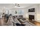 The spacious living room features a fireplace, ceiling fan, and hardwood floors at 5320 Flat Rock Pt, Lithonia, GA 30038