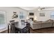 Open concept kitchen flows to living area with an adjacent fireplace and hardwood floors at 5320 Flat Rock Pt, Lithonia, GA 30038