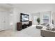 Bright living room has speakers, a TV, and a comfortable couch at 5320 Flat Rock Pt, Lithonia, GA 30038