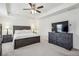 Bright main bedroom with a ceiling fan and ample furniture at 5320 Flat Rock Pt, Lithonia, GA 30038