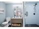 Modern bathroom with a stand-up shower, marble vanity, and stylish blue walls at 791 Wylie Se St # 807, Atlanta, GA 30316