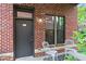 Inviting exterior with brick facade, cozy seating, and a well-lit entrance at 791 Wylie Se St # 807, Atlanta, GA 30316