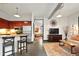 Open concept living space with a modern kitchen, exposed ductwork, and stylish furniture at 791 Wylie Se St # 807, Atlanta, GA 30316