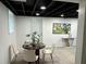 Finished basement area with modern lighting, neutral paint, dining area, and stylish decor at 10 Rockmart Nw Dr, Atlanta, GA 30314