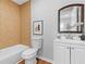 Bathroom featuring a toilet, vanity, mirror, and shower with tile surround at 10 Rockmart Nw Dr, Atlanta, GA 30314
