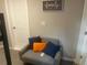 Cozy reading nook with comfy chair and throw pillows next to a bunk bed, creating a relaxing atmosphere at 10 Rockmart Nw Dr, Atlanta, GA 30314