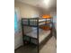 Cozy bedroom featuring a bunk bed with white linens and natural light from the windows at 10 Rockmart Nw Dr, Atlanta, GA 30314