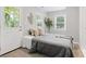 Bright bedroom with natural light, decorative pillows, and cozy bed with a gray throw at 10 Rockmart Nw Dr, Atlanta, GA 30314