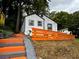 Exterior angle featuring a charming, light-colored house with an orange painted fence at 10 Rockmart Nw Dr, Atlanta, GA 30314