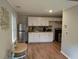 Modern kitchen featuring stainless steel appliances, white cabinetry, and tile backsplash at 10 Rockmart Nw Dr, Atlanta, GA 30314