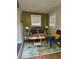 Inviting living room with a comfortable couch, stylish rug, and plenty of natural light at 10 Rockmart Nw Dr, Atlanta, GA 30314