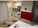 Cozy living space featuring a bed, and kitchenette with white cabinetry, stainless steel appliances at 10 Rockmart Nw Dr, Atlanta, GA 30314