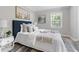 Relaxing main bedroom with decorative pillows, neutral tones, and a calming view of nature at 10 Rockmart Nw Dr, Atlanta, GA 30314