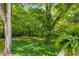 The lush greenery and mature trees in backyard offer a private and tranquil outdoor retreat at 1150 Kennesaw Due West Nw Rd, Kennesaw, GA 30152