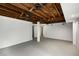 Spacious unfinished basement with exposed ceiling beams and freshly painted white walls at 1150 Kennesaw Due West Nw Rd, Kennesaw, GA 30152