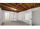 Unfinished basement with painted white walls, concrete floor and multiple entries at 1150 Kennesaw Due West Nw Rd, Kennesaw, GA 30152