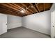 Unfinished basement with painted white walls and a concrete floor at 1150 Kennesaw Due West Nw Rd, Kennesaw, GA 30152