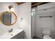 Clean bathroom with modern vanity, round mirror, and walk-in shower at 1150 Kennesaw Due West Nw Rd, Kennesaw, GA 30152
